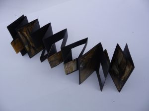 black-and-yellow-concertina-with-cutouts-4